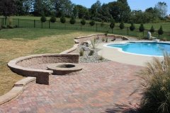 Backyard Patio and Fire pit next to Swimming Pool